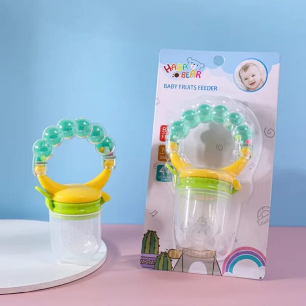 Hafta Bazaar by “Baby rattle fruit pacifier made with soft silicone for safe feeding, teething, and playful sound.”
