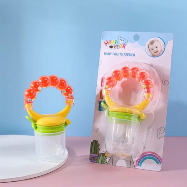 Hafta Bazaar by “Baby rattle fruit pacifier made with soft silicone for safe feeding, teething, and playful sound.”