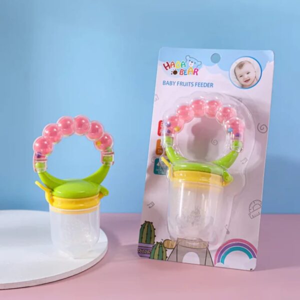 Hafta Bazaar by “Baby rattle fruit pacifier made with soft silicone for safe feeding, teething, and playful sound.”