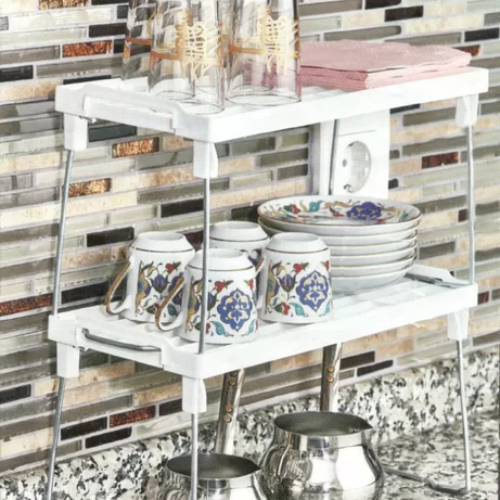 Stack-up shelf with multiple tiers designed for organized storage and space saving.